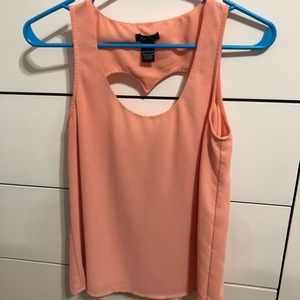Peach tank top with heart cross out on back
